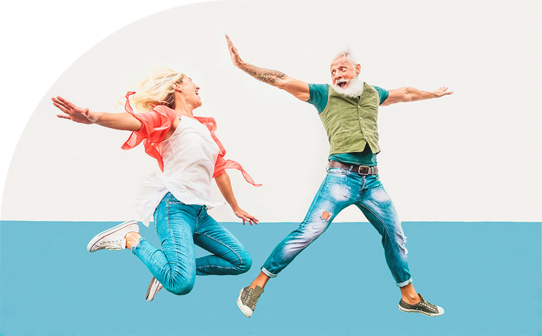 Older couple leaping for joy.