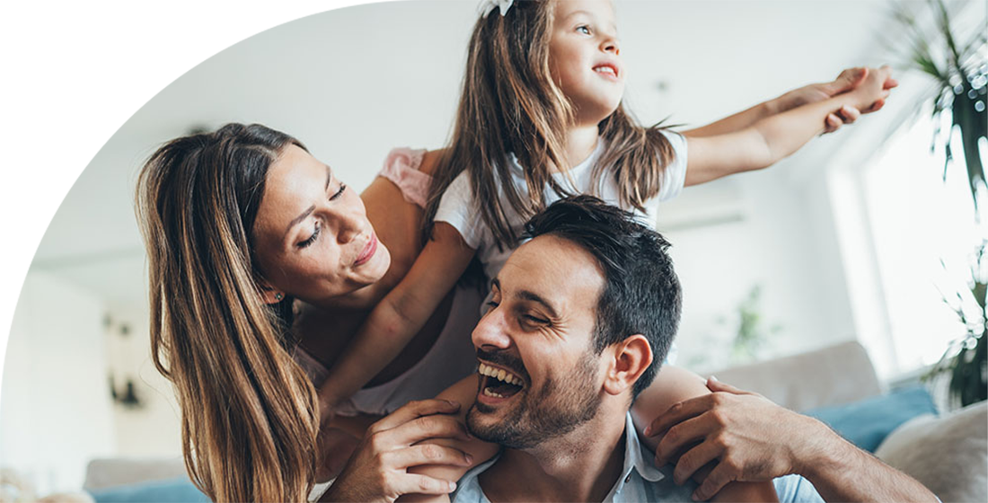 Couple and little girl laughing.