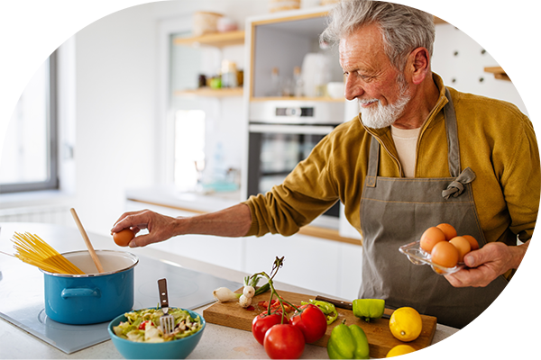 Older man cooking.